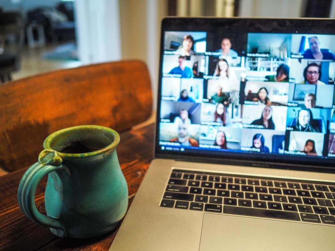 Video Conferencing on a laptop with coffee