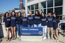 Student Staff in front of Palmer Commons Sign